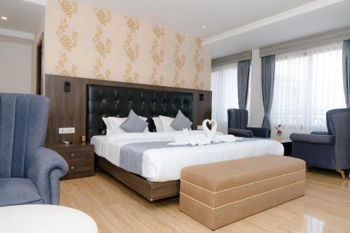 Ένα ή περισσότερα κρεβάτια σε δωμάτιο στο Maharaja The Royal Hotel & Casino