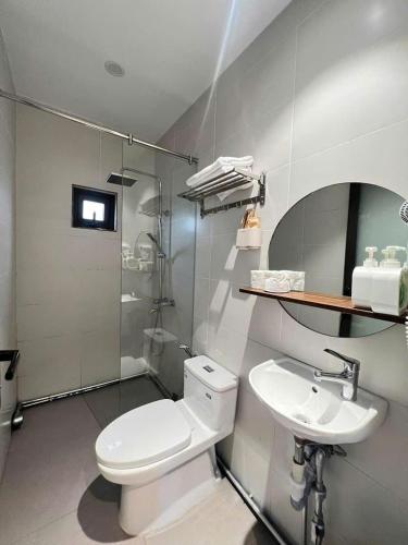 a bathroom with a toilet and a sink at COCO HOUSE Bùi Thị Xuân, Đà Lạt in Da Lat