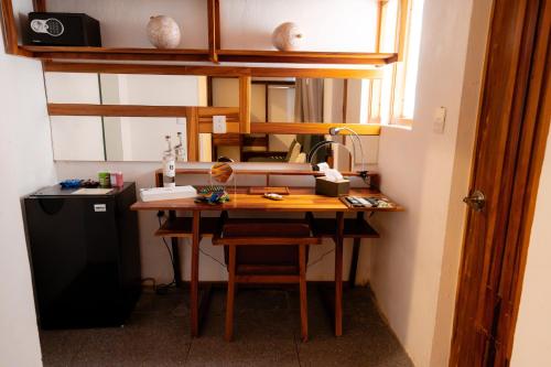 a wooden desk in a room with a sink at Casa de Arte Hotel Boutique in Oaxaca City