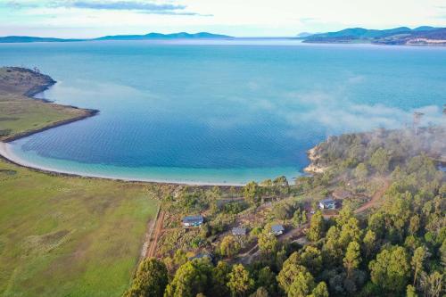 an aerial view of the shore of a lake at Spring Bay Mill in Triabunna