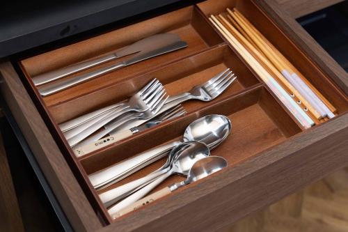 a drawer with silver utensils in a wooden box at Macchiato SHONAN-Vacation Stay- in Hiratsuka