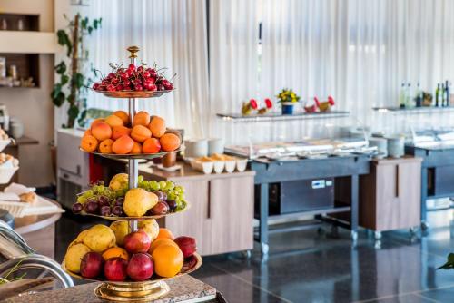 two tiers of fruit on display in a kitchen at Belvedere Resort Hotels in Izola