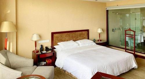 Letto o letti in una camera di Urumqi Tianyuan Hotel