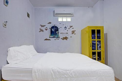 Postel nebo postele na pokoji v ubytování Hotel O Kedai Cinta Guest House