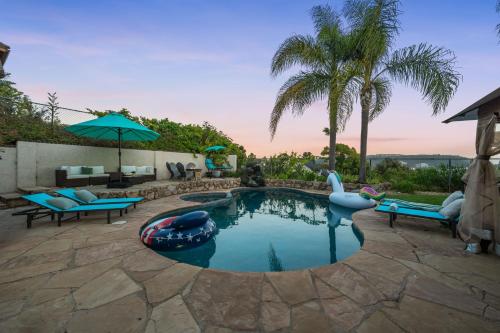 a swimming pool with an inflatablelatable raftituresitures at Entire Private Hot Tub, King Bed, Garage, Grand View, 3BR-3Bth, Available Now in San Diego