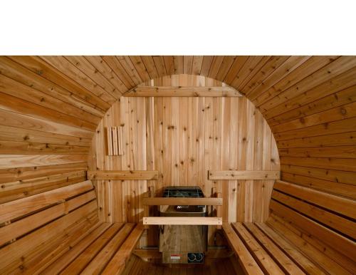an inside view of a wooden sauna at Sedona Uptown Gem!Large yard w grass and shade trees! Views!! NEW! BARREL SAUNA!!! Close to trails, walk to Uptown Sedona, restaurants and shopping in Sedona