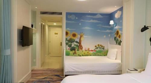 a bedroom with a mural of a giraffe at Jinjiang Metropolo Hotel Classiq YMCA People Square in Shanghai
