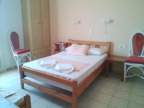 Postel nebo postele na pokoji v ubytování Apollon