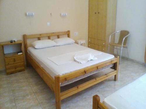 Postel nebo postele na pokoji v ubytování Apollon