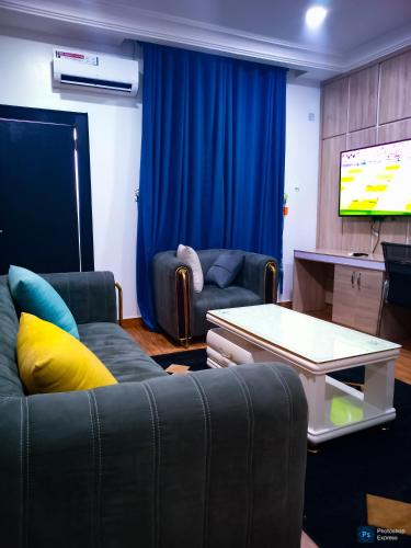 TV a/nebo společenská místnost v ubytování Tap-Talle Hotel & Suites