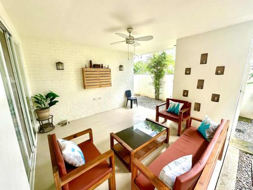 a living room with a couch and a table at House at the City Center in Tuguegarao City