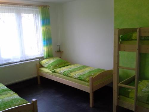 Postel nebo postele na pokoji v ubytování Apartmán Hastrmánek, Kvilda 3