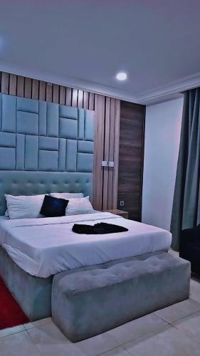 Postel nebo postele na pokoji v ubytování Tap-Talle Hotel & Suites