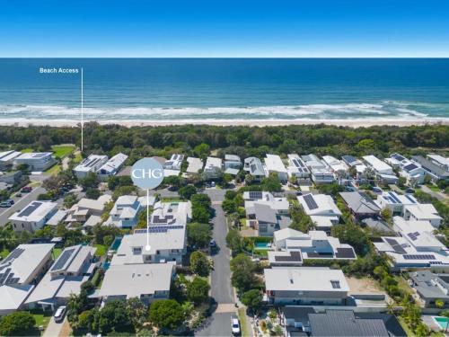 an aerial view of the beach houses at the beach at Casuarina Dreaming Townhouse with Pool in Kingscliff