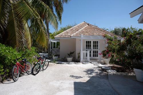 a group of bikes parked in front of a house at Coriolana home in Savannah Sound