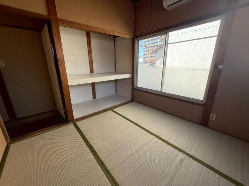 桑名のお宿参宮通 長島スパーランド桑名駅徒歩圏一軒家最大11名宿泊可能にあるベッド