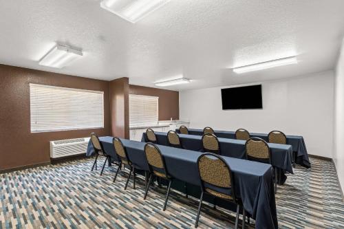 a conference room with a long table and chairs at Quality Inn & Suites Denver International Airport in Denver