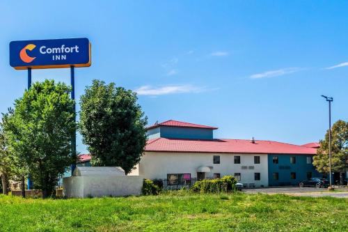 a sign for a comfort inn in front of a building at Comfort Inn Las Vegas New Mexico in Las Vegas