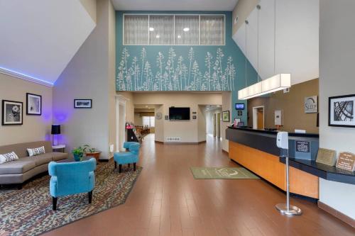 a lobby of a hospital with a couch and chairs at Sleep Inn & Suites Smyrna - Nashville Area in Smyrna