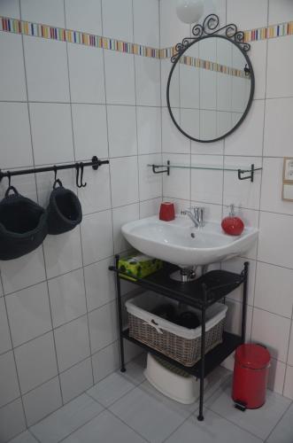a bathroom with a sink and a mirror at Ubytování u Muzea hraček in Lednice