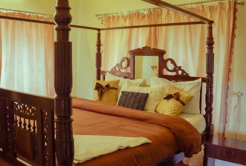 Ένα ή περισσότερα κρεβάτια σε δωμάτιο στο Willostays Cloudhill ooty