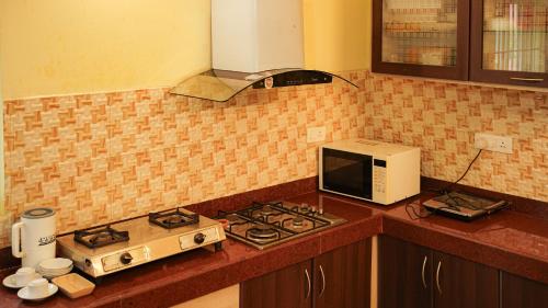Η κουζίνα ή μικρή κουζίνα στο Willostays Cloudhill ooty