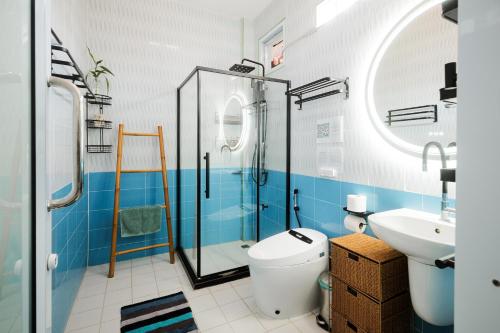 a bathroom with a shower and a toilet and a sink at Sunset beach apartment 12 O3 villas in Koh Phangan