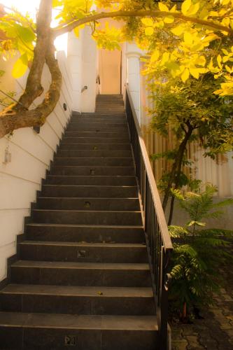 a set of stairs leading up to a building at Cieloblu In Hotel Matara in Palatuwa