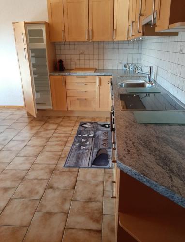 a kitchen with a stove in the middle of the floor at Oeillet 4 in Champoussin