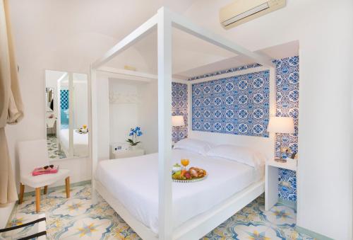 Katil atau katil-katil dalam bilik di Relais Correale Rooms & Garden