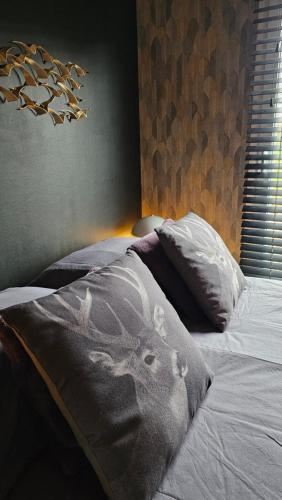 a bed with a picture of a rabbit on it at O'Blanche, Viroinval Treignes in Treignes