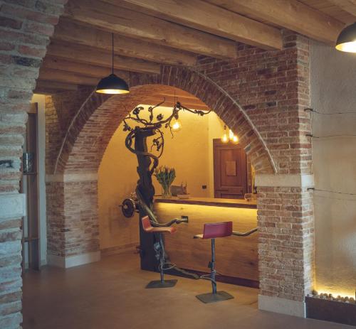 an archway with a scooter in a room at IL Pollaio in Farra di Soligo