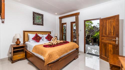 Ένα ή περισσότερα κρεβάτια σε δωμάτιο στο JP House Ubud