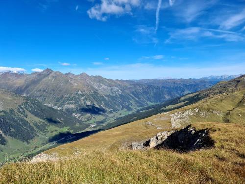 a view of a mountain with mountains in the background at Kleintierhof Seidl-Eder in Rauris
