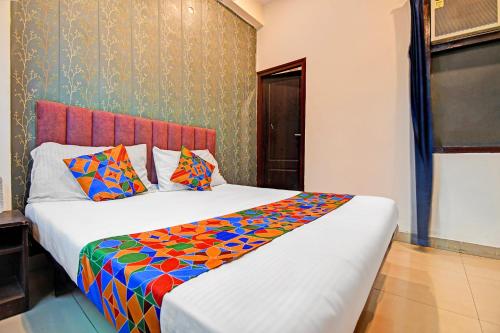 Ένα ή περισσότερα κρεβάτια σε δωμάτιο στο FabHotel Insight Inn