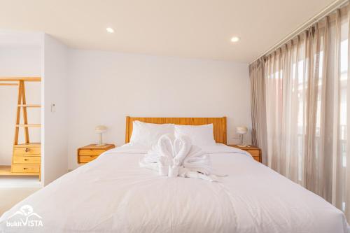 Ένα ή περισσότερα κρεβάτια σε δωμάτιο στο Wolu Residence 5 by Bukit Vista