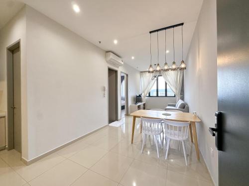 a kitchen and dining room with a table and chairs at Iconic Regency by Li in Gelugor