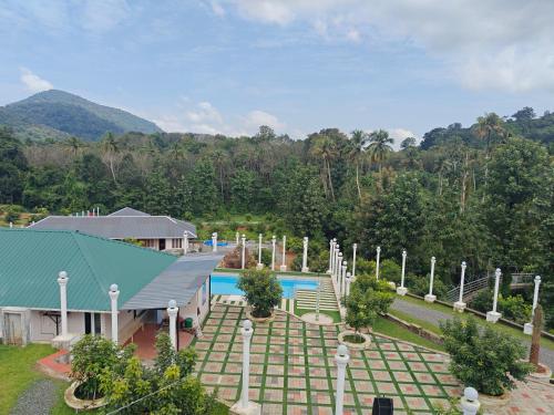 an aerial view of a resort with a swimming pool at AppleLand City Athirapilly by Hotels Cart in Athirappally