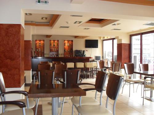 TV a/nebo společenská místnost v ubytování Hotel Olympion