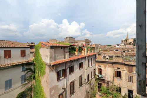 a view of a city from the roofs of buildings at Terrazze Navona in Rome