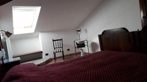 Ένα ή περισσότερα κρεβάτια σε δωμάτιο στο Agriturismo La Rossa
