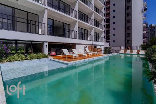 a swimming pool in front of a building at Maison Perdizes - Allianz Parque Supreme in Sao Paulo
