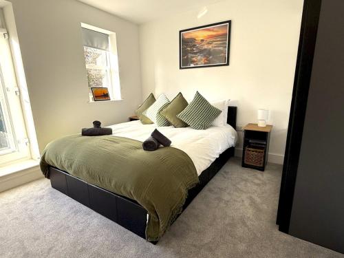 En eller flere senge i et værelse på Pass the Keys Turners Nook