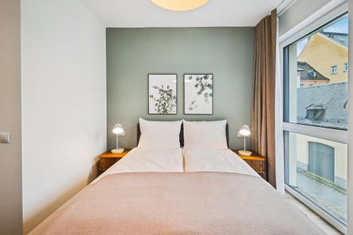 Limehome Chemnitz Kirchgässchenにあるベッド