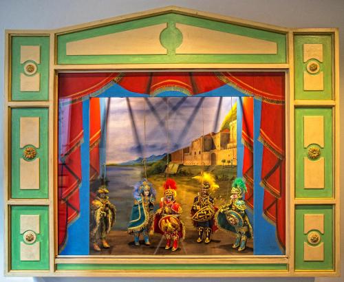 a painting of three people riding elephants in a circus at Tra Le Braccia di Morfeo in Terrasini