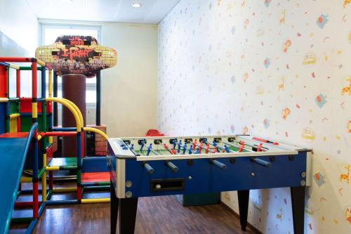 a childrens play room with a foosball table at Scandic Helsinki Aviapolis in Vantaa