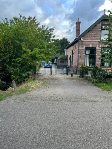an empty driveway in front of a brick building at Vlinder 2pers studio in Utrecht