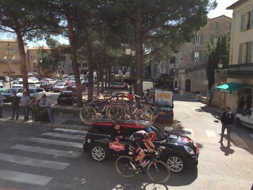 a car with bicycles on the back parked on a street at Auberge De Tourrettes in Tourrettes-sur-Loup