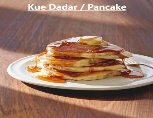 a stack of pancakes on a plate on a table at Coliving Bali SWEET HOME Kost Lengkap di Tabanan Kota in Tabanan