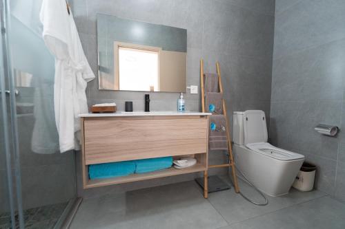 a bathroom with a sink and a toilet at Mauritius in Midlands Station